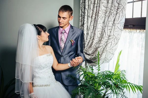 Charming bride and groom on their wedding celebration in a luxurious restaurant. Loving couple on date — Stock Photo, Image