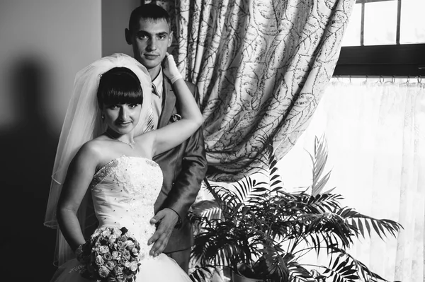 Charming bride and groom on their wedding celebration in a luxurious restaurant. Loving couple on date — Stock Photo, Image