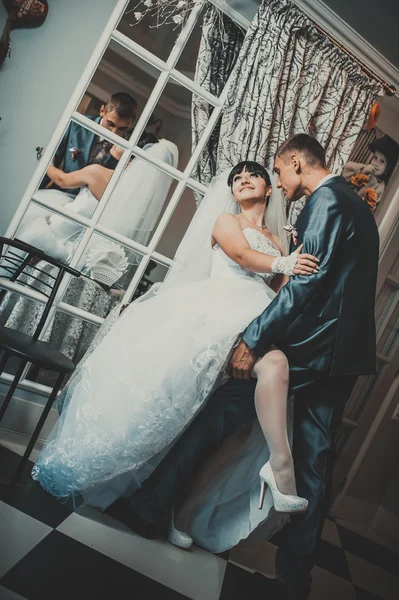 Charming bride and groom on their wedding celebration in a luxurious restaurant. Loving couple on date — Stock Photo, Image