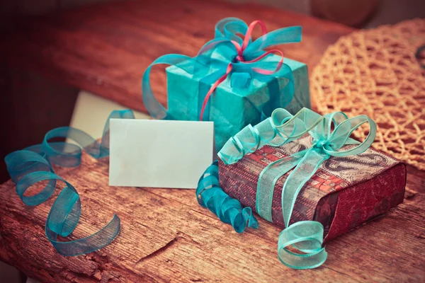 Christmas gift boxes with decorative tapes — Stock Photo, Image