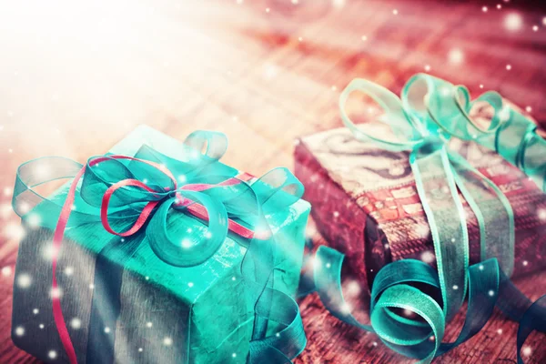 Christmas gift boxes with decorative tapes — Stock Photo, Image