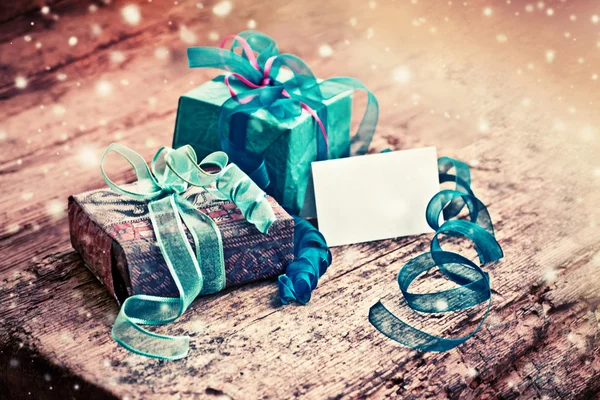 Christmas gift boxes with decorative tapes — Stock Photo, Image