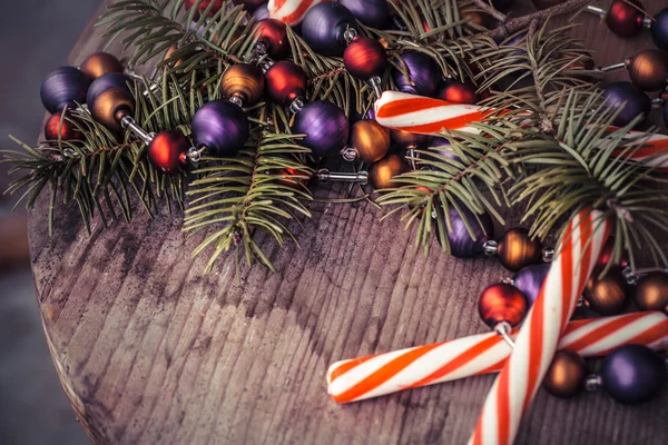 Pine tree branches with candy canes — Stock Photo, Image