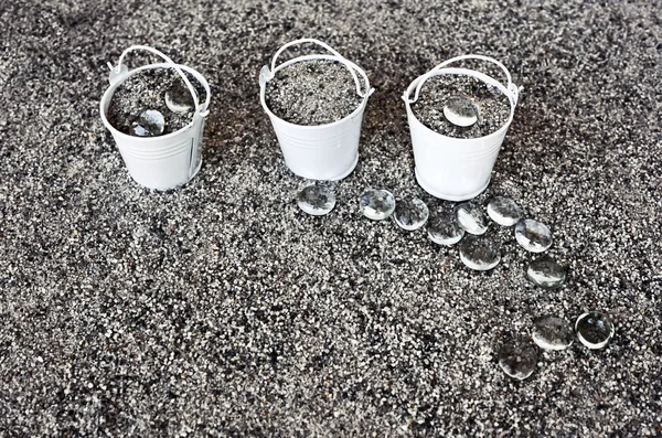 Little white buckets full of sand — Stock Photo, Image