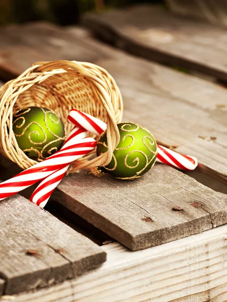 Christmas  candies and balls in basket — Stock Photo, Image