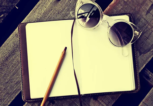 Sunglasses, copybook with pen — Stock Photo, Image