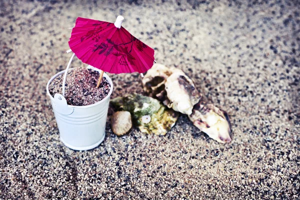 Little white bucket full of sand — Stock Photo, Image