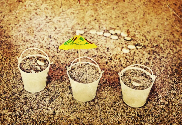 Little white buckets full of sand — Stock Photo, Image