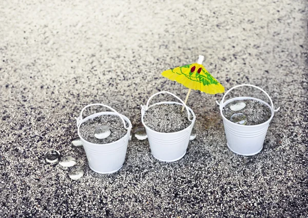 Little white buckets full of sand — Stock Photo, Image