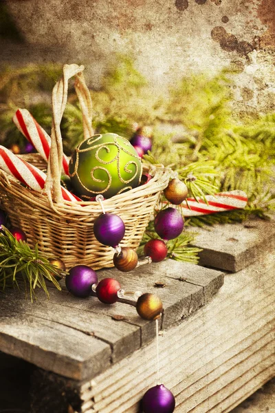 Christmas  candies and balls in basket — Stock Photo, Image