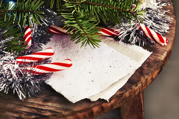 Christmas candies and fir branches — Stock Photo, Image