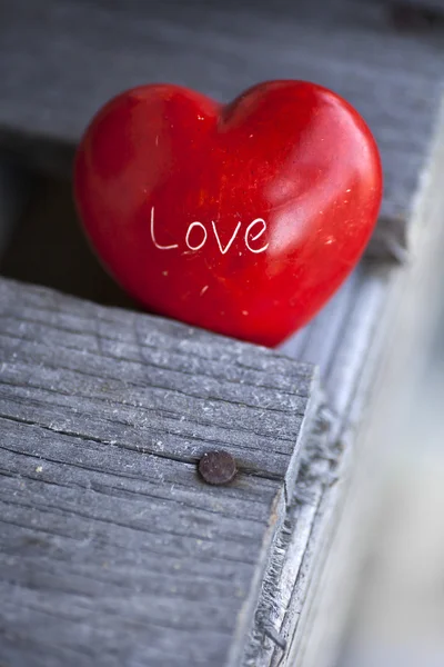 Red heart on wooden table — Stock Photo, Image