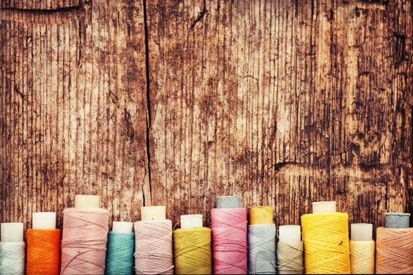 Bobbins with colorful threads — Stock Photo, Image