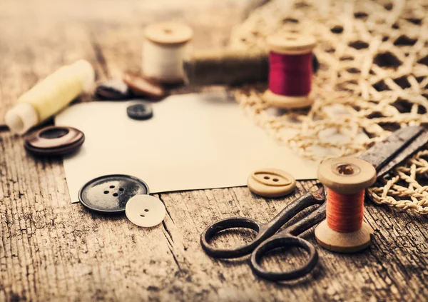 Scissors , buttons and bobbins with threads