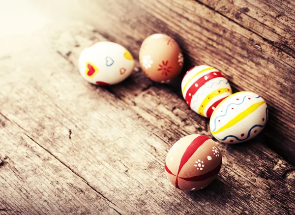 Easter eggs on old wooden background — Stock Photo, Image