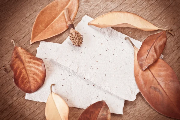 Autumn background with leaves and papers — Stock Photo, Image