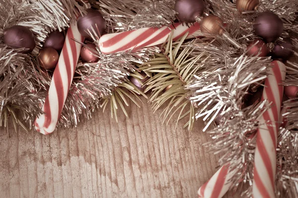 Pine tree branches with candy canes — Stock Photo, Image