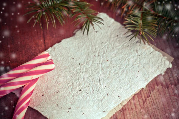 Pine tree branches with candy canes — Stock Photo, Image