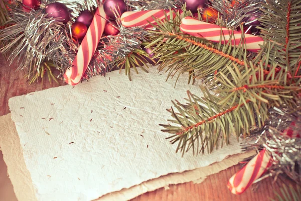 Pine tree branches with candy canes — Stock Photo, Image