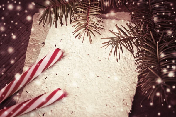 Pine tree branches with candy canes — Stock Photo, Image