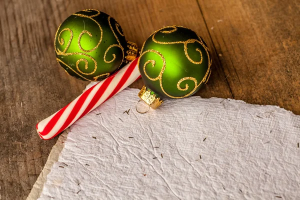 Background with candies, fir branches with blank paper — Stock Photo, Image