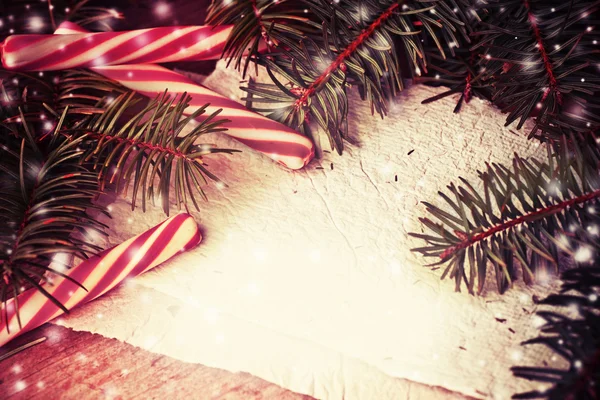 Pine tree branches with candy canes — Stock Photo, Image