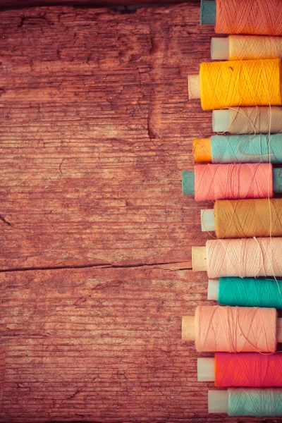 Bobbins with colorful threads — Stock Photo, Image