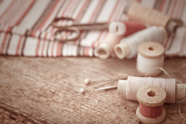 Scissors and bobbins with threads