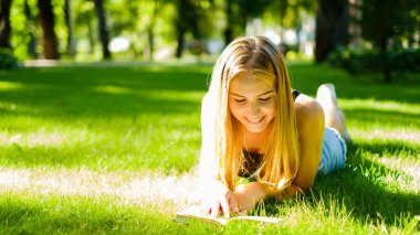 Beautiful girl with a book clipart