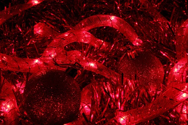 Glowing cord and tinsel — Stock Photo, Image