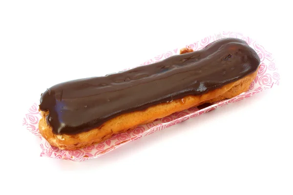 Eclair in a wrapper — Stock Photo, Image