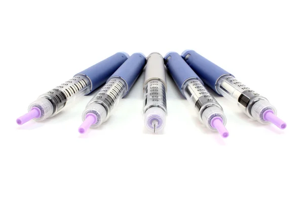 Fan of five open syringe pen — Stock Photo, Image