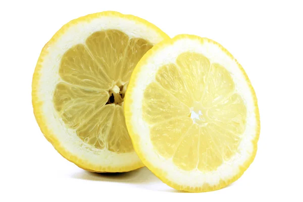 Половина лимона і скибочки — стокове фото