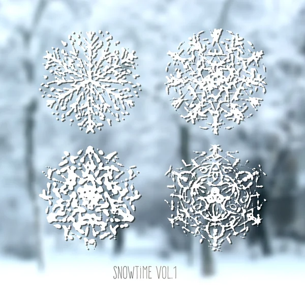 Snowflakes collection on winter blurred background — Stock Vector