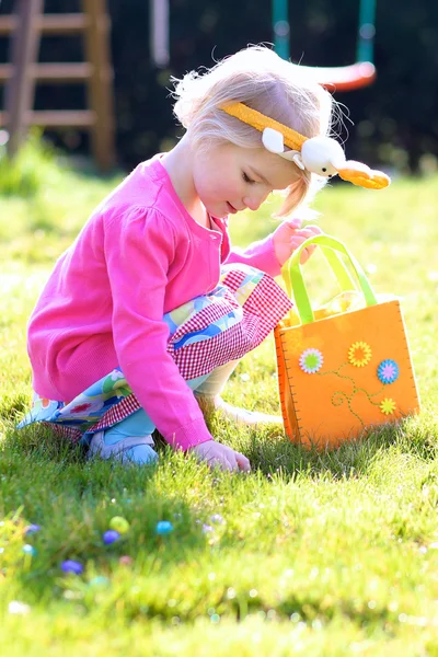 Kid enjoying Easter eggs hunt — Stock Photo, Image