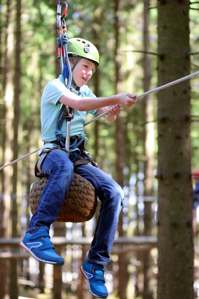 Teenage boy climbing on the ropes — Stock Photo, Image