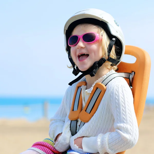 Little girl enjoying bike trip in child seat — Stock Photo, Image