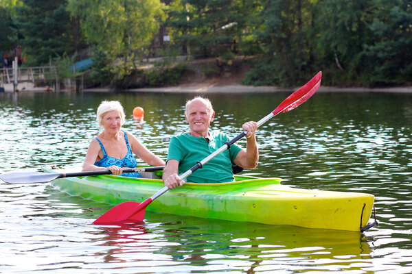 Seniors kayaking on the river