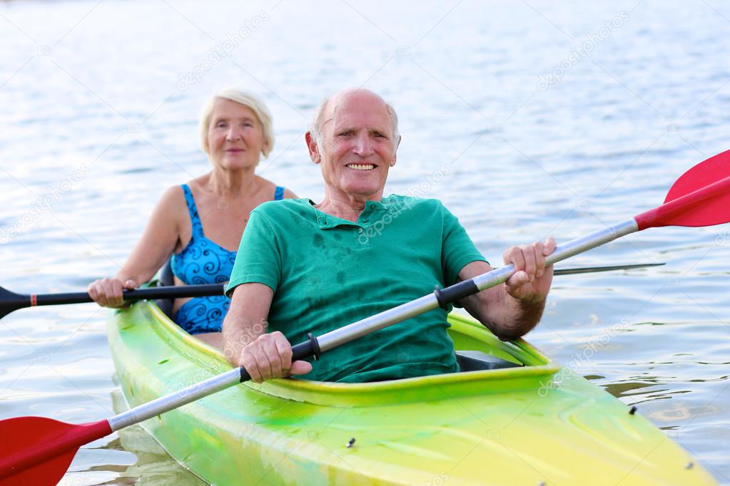 Seniors kayaking on the river