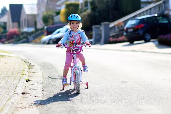 Toddler girl riding with her bike — Stock Photo, Image