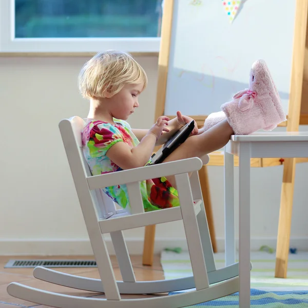 Little girl playing with tablet pc — Stock Photo, Image