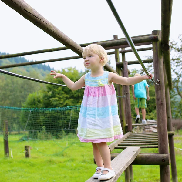 Toddler girl having fun at playground — Stock Photo, Image