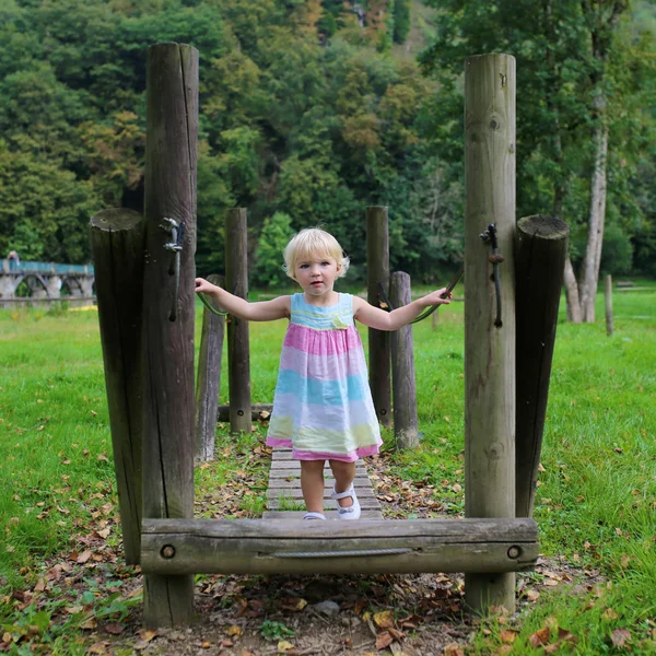 Toddler girl having fun at playground — Stock Photo, Image