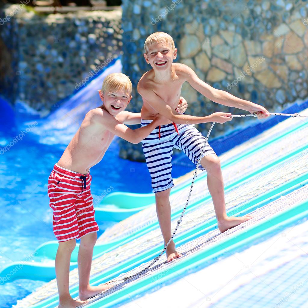 Two brothers having fun at aqua park