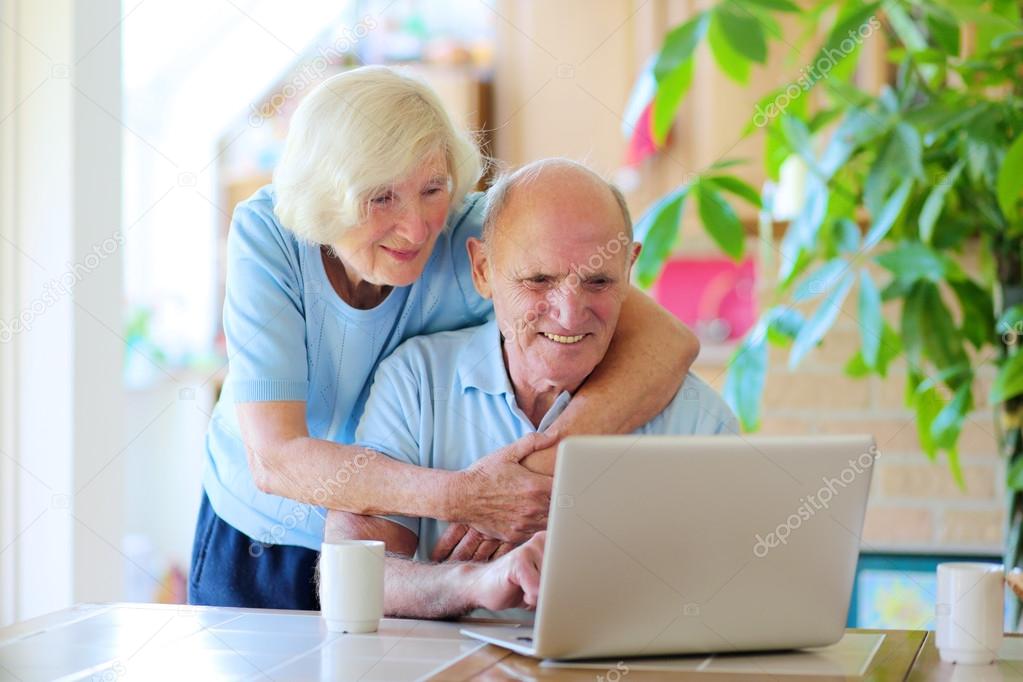 Modern senior couple relaxing at home