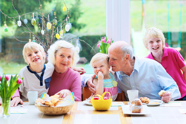 Grandparents with grandchildren enjoying Easter breakfast
