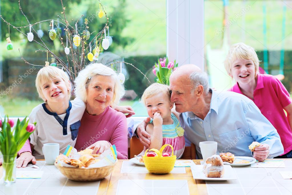 Grandparents with grandchildren enjoying Easter breakfast