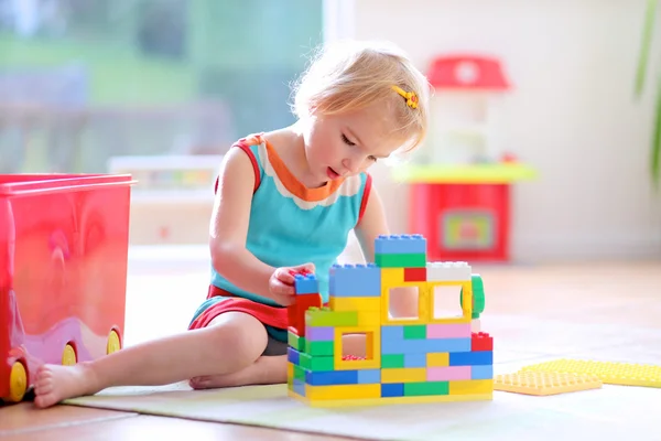 Little girl playing with construction blocks — Stock Photo, Image
