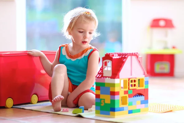 Little girl playing with construction blocks — Stock Photo, Image