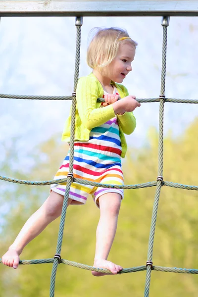 Little girl having fun at playground on summer day — Stock Photo, Image